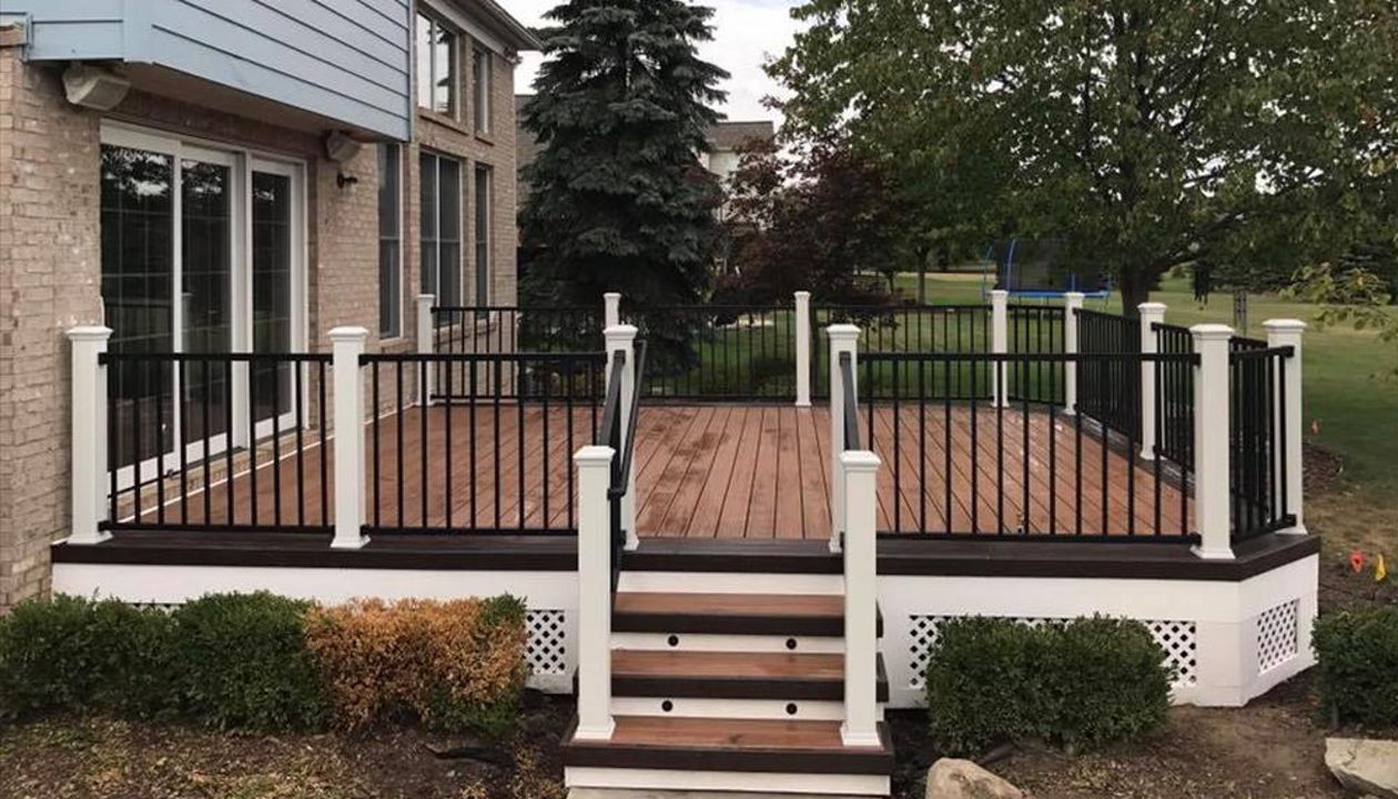 Tiki torch with vintage lantern border and picture framed maintenance free lattice