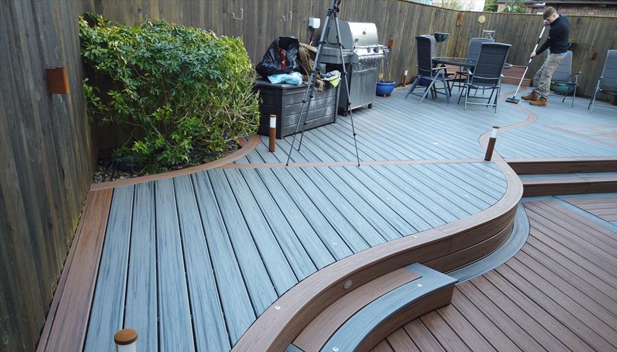 Trex Transcend Island Mist with Tiki Torch Custom Curve design fitted at Swansea