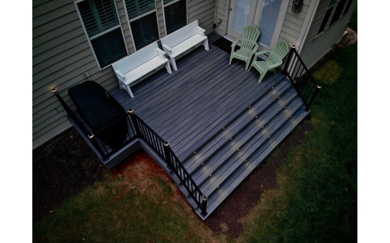 Awesome Signature railings with post cap and riser lights!