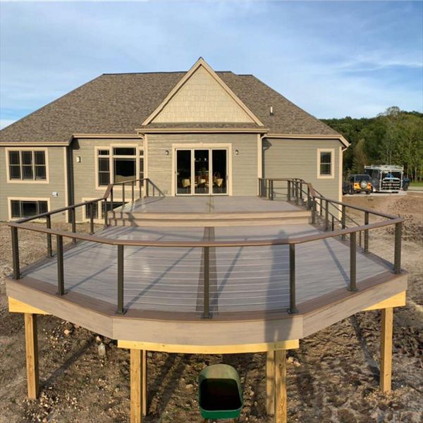 This deck features Trex enhance rocky harbor as main deck and Trex enhanced toasted sand as picture frame/middle divider. It has a toasted sand drink rail.