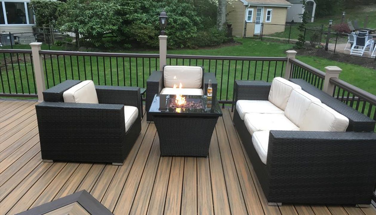Lounging by the fire pit on a beautiful Trex deck