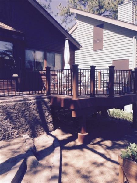Prescott AZ.  Tiki Torch with groove, hidden clips.  Trex joist tape.  Tied into paver hardscape patio.