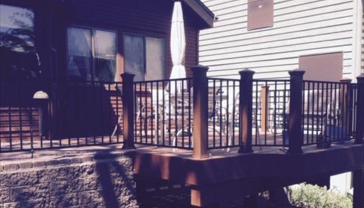 Prescott AZ.  Tiki Torch with groove, hidden clips.  Trex joist tape.  Tied into paver hardscape patio.