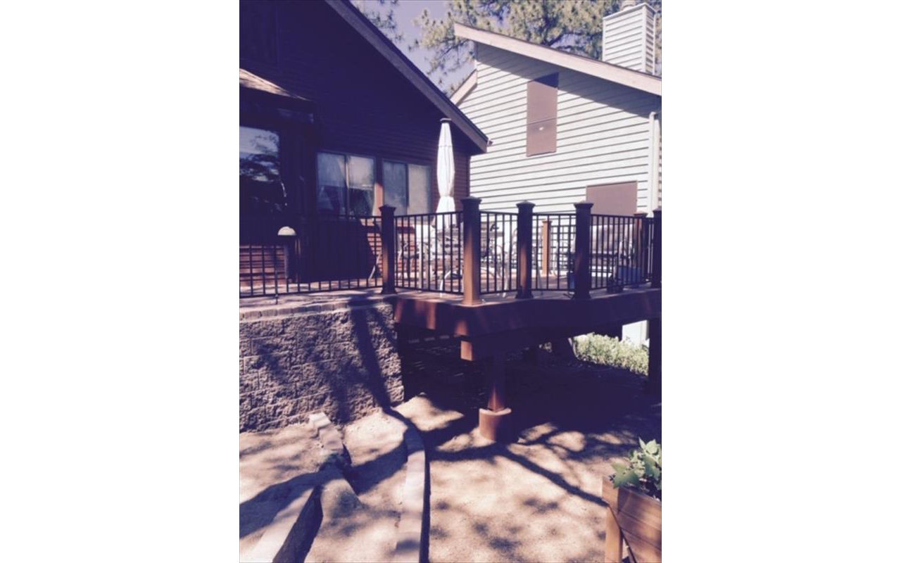 Prescott AZ.  Tiki Torch with groove, hidden clips.  Trex joist tape.  Tied into paver hardscape patio.