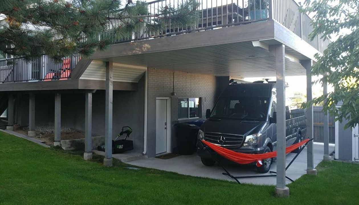 clam shell deck with trex rainescape and soffit underlay for rv parking