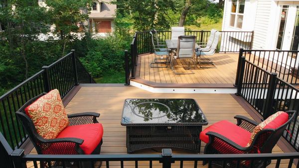 Two tiers create well defined areas without a total separation. Trex lighting adds additional ambiance and safety at night.