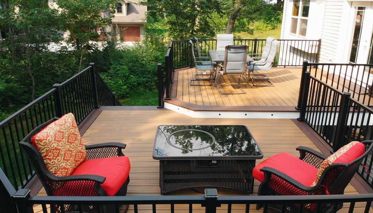 Two tiers create well defined areas without a total separation. Trex lighting adds additional ambiance and safety at night.