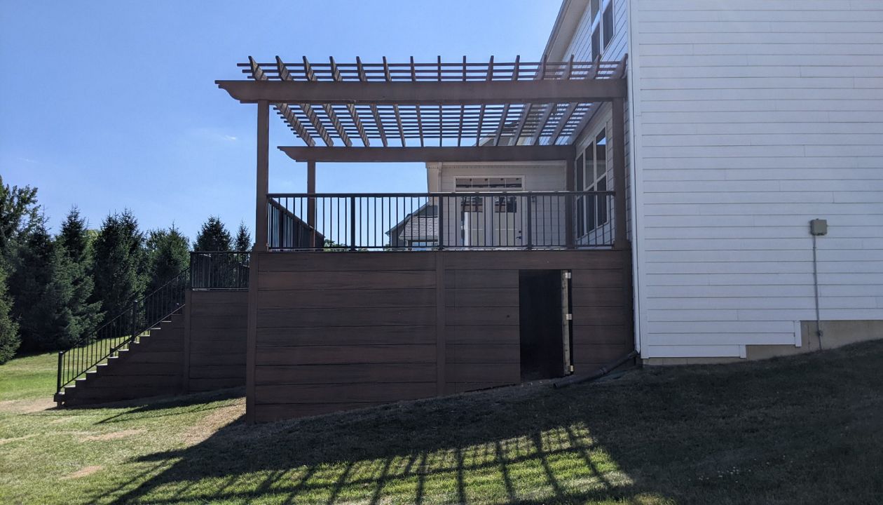 Trex Transcend Havana Gold with hidden doors in skirting.