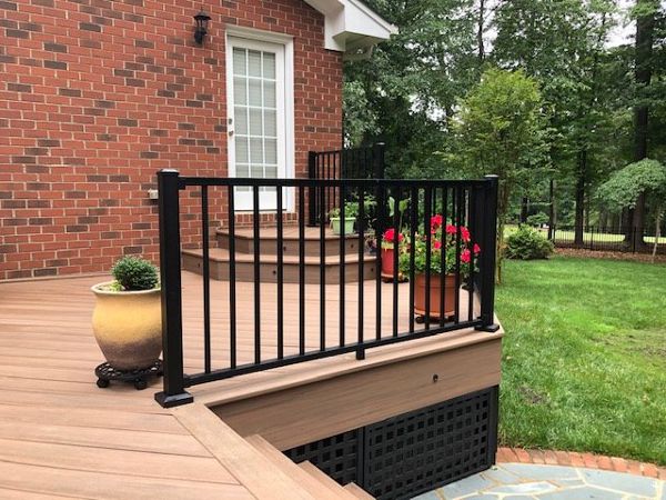 Trex Signature Black railing does great with the brick and hardscape area of this house