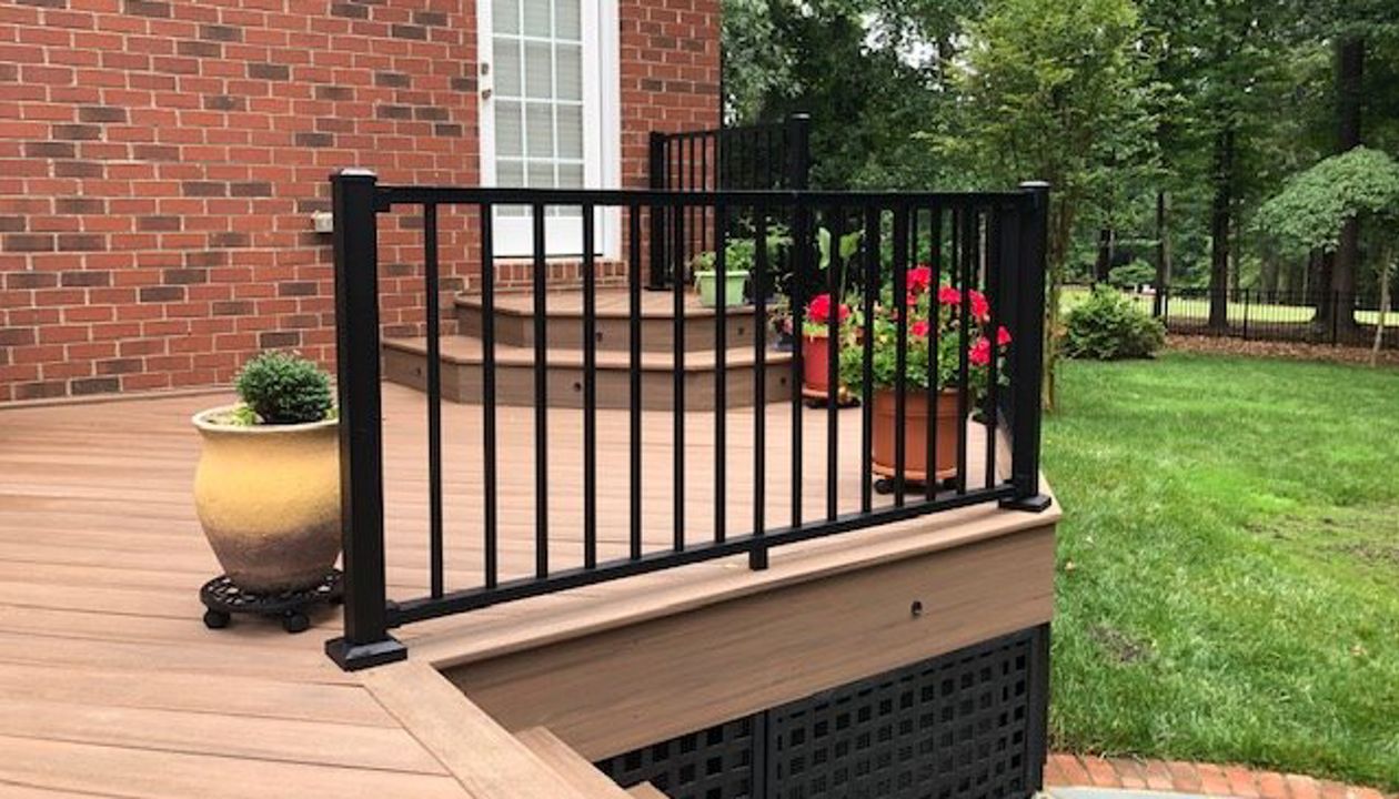 Trex Signature Black railing does great with the brick and hardscape area of this house