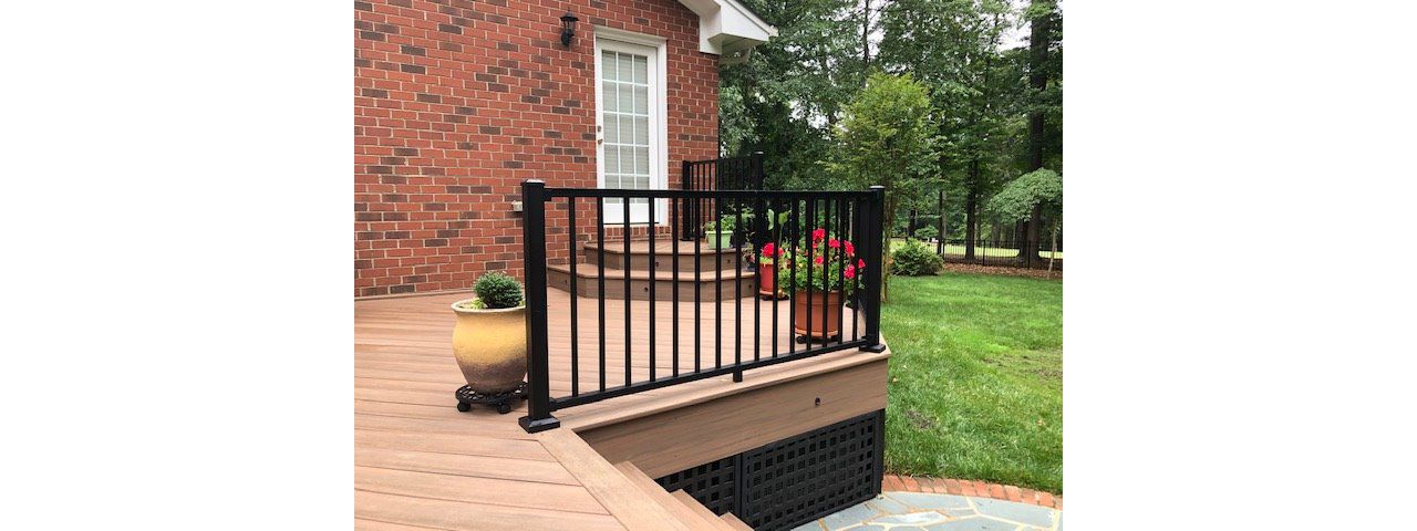 Trex Signature Black railing does great with the brick and hardscape area of this house