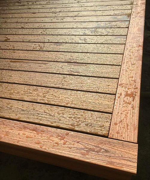 Trex Tropical Decking. Havana Gold inlay with Tiki Torch picture frame accent