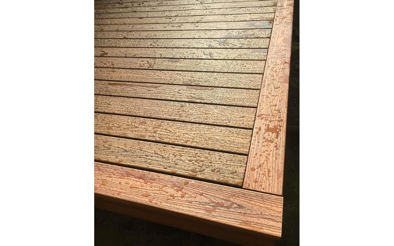 Trex Tropical Decking. Havana Gold inlay with Tiki Torch picture frame accent