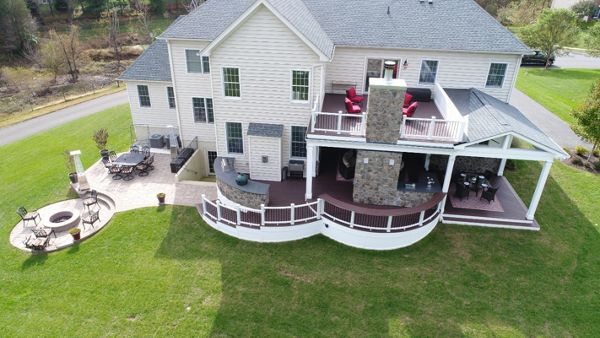 Trex Curved Deck with Open Porch, Fireplace, Outdoor Kitchen, & Paver Patio
