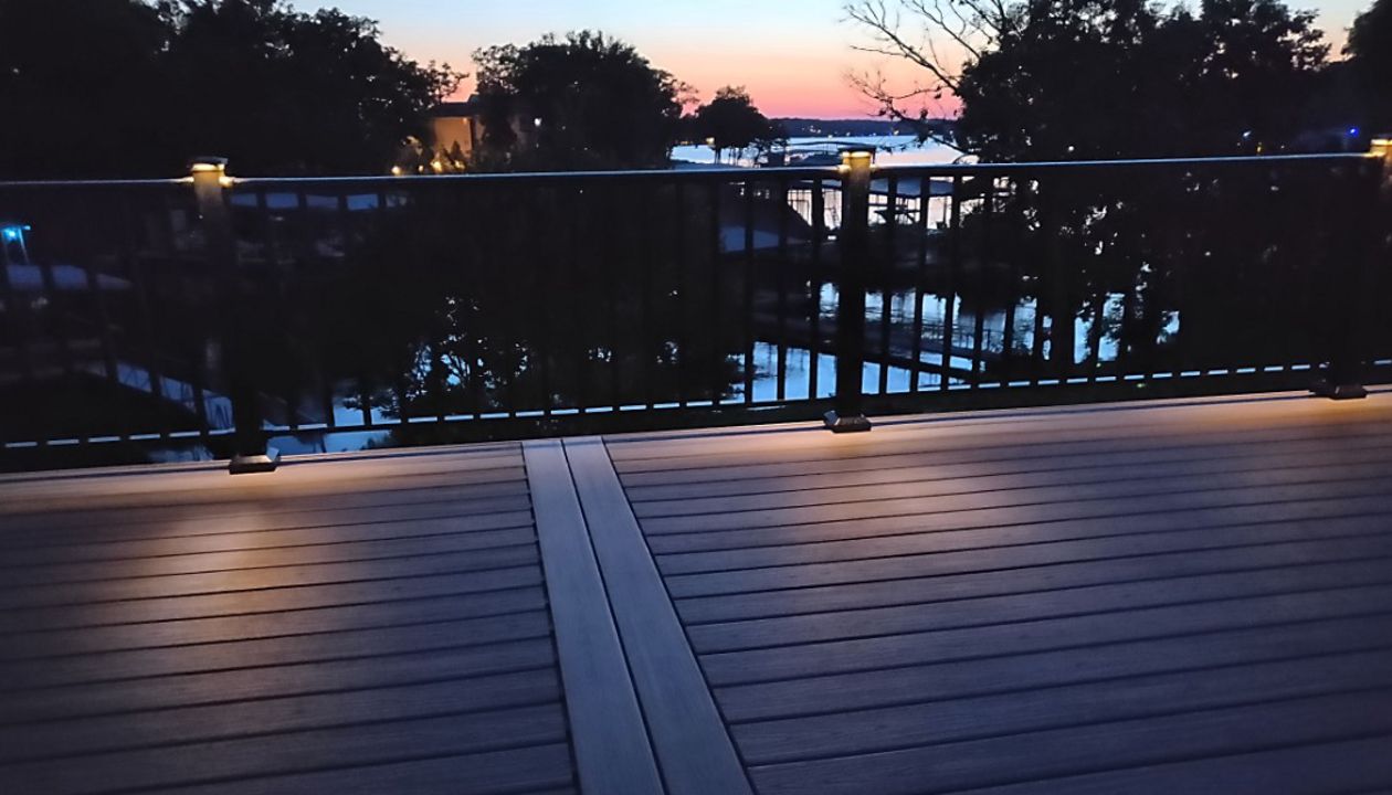 Trex Island Mist decking, Black aluminum railing with low voltage LED post lights done in Lake Ozark, MO