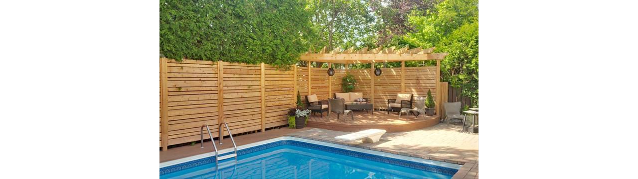 Tiki Torch sitting area by the pool; curved fascia