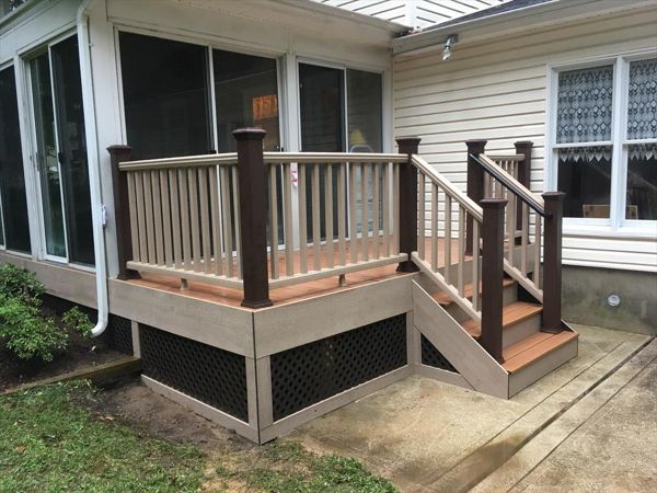 This deck highlights the ease of  customization with the Trex Transcend railing. This homeowner wanted a unique look so we paired Rope Swing rails with Vintage Lantern Posts. We also picture framed the lattice with Rope Swing fascia. Tiki Torch decking.