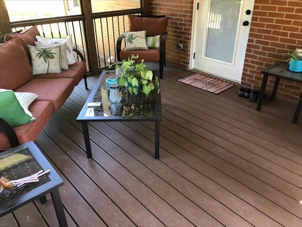Covered porch area with Saddle Select decking is a wonderful outdoor oasis in the summer heat