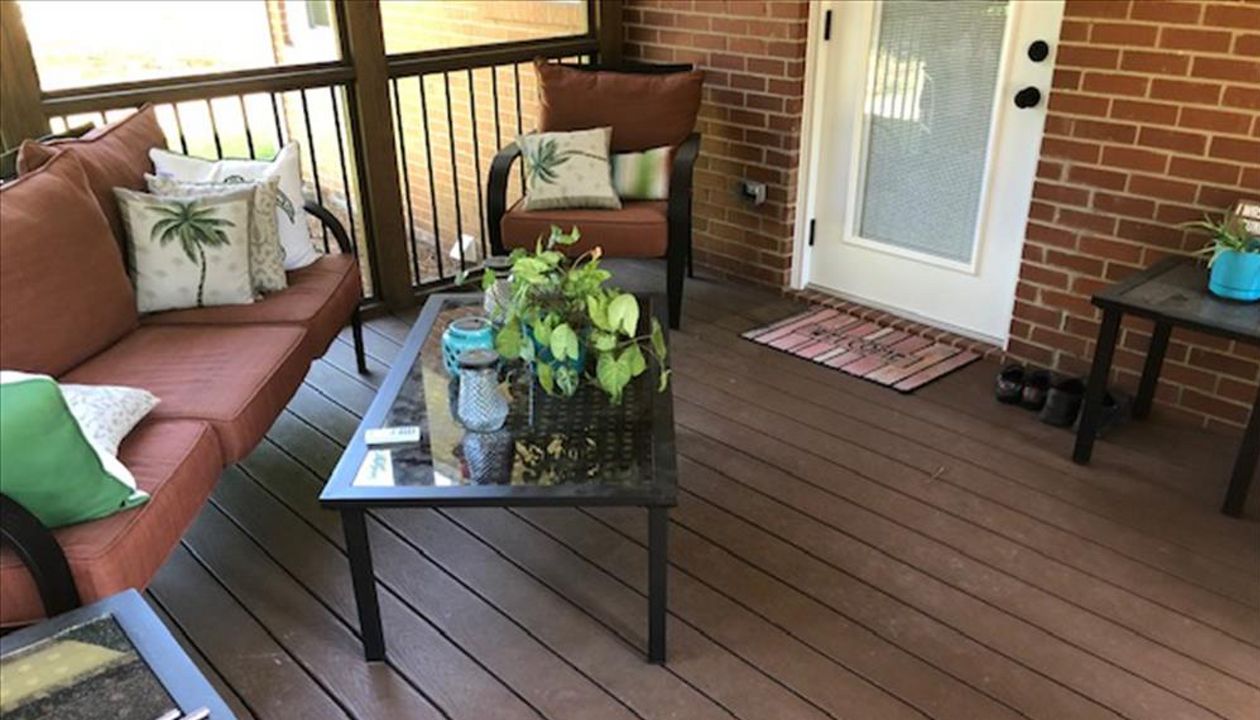 Covered porch area with Saddle Select decking is a wonderful outdoor oasis in the summer heat
