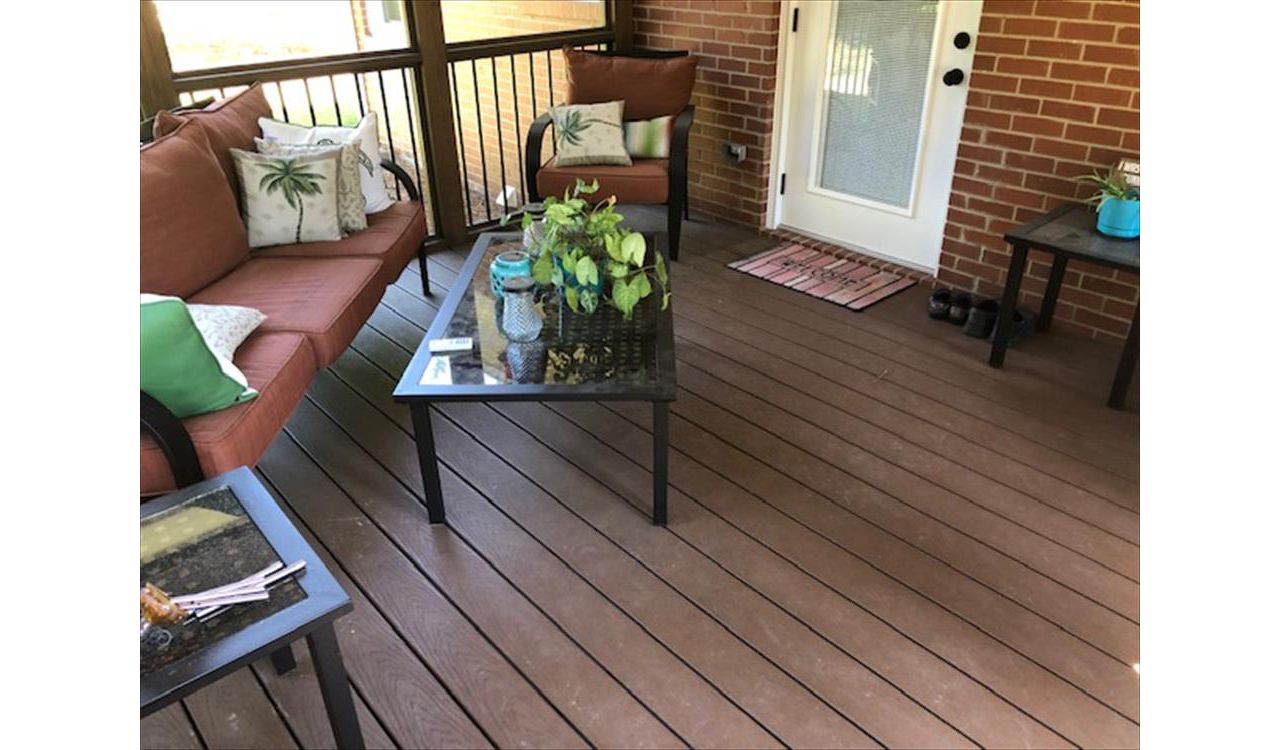 Covered porch area with Saddle Select decking is a wonderful outdoor oasis in the summer heat