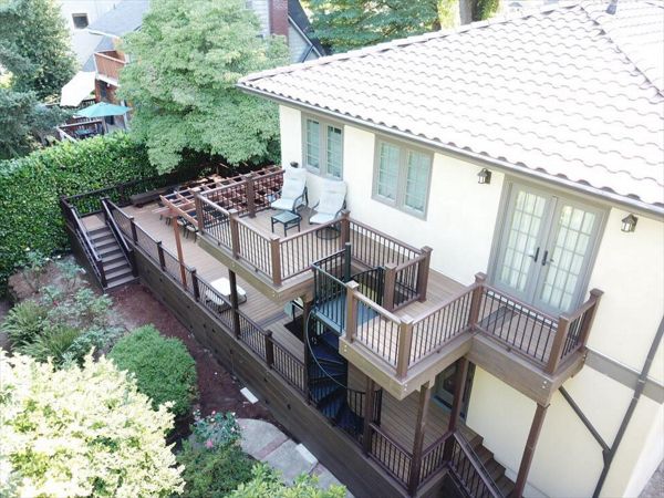 Portland Deck featuring Trex Havana Gold, Transcend Railing, Trex Lighting, Fascia, Trex Spiral Staircase.