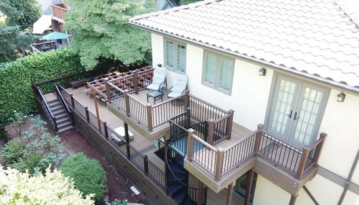 Portland Deck featuring Trex Havana Gold, Transcend Railing, Trex Lighting, Fascia, Trex Spiral Staircase.