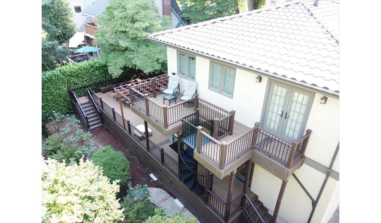 Portland Deck featuring Trex Havana Gold, Transcend Railing, Trex Lighting, Fascia, Trex Spiral Staircase.