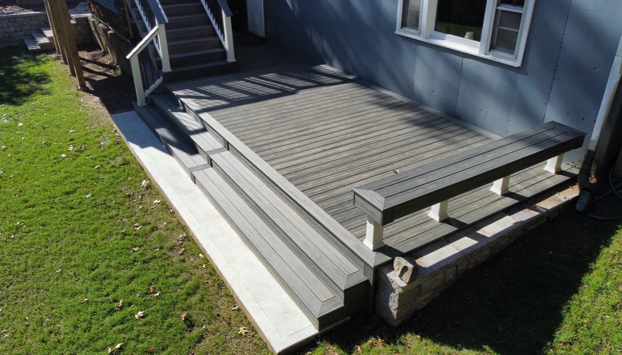 Beautiful Built-In Custom Bench in 2-Tier 800 Square Foot Deck, Trex Transcend Island Mist Decking with Trex Transcend Railings and Cocktail Rails, in Ipswich, MA
