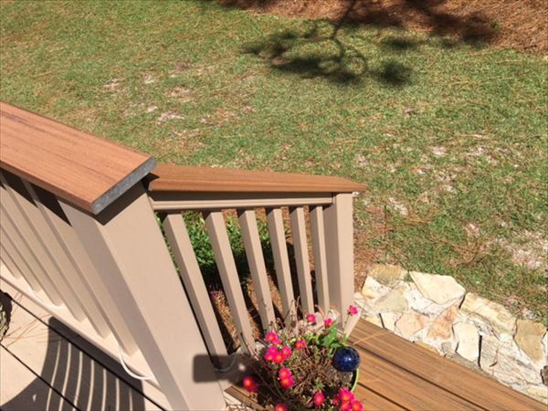 Trex Havana Gold cocktail railing cap finishes off the look of this Rope Swing railing.