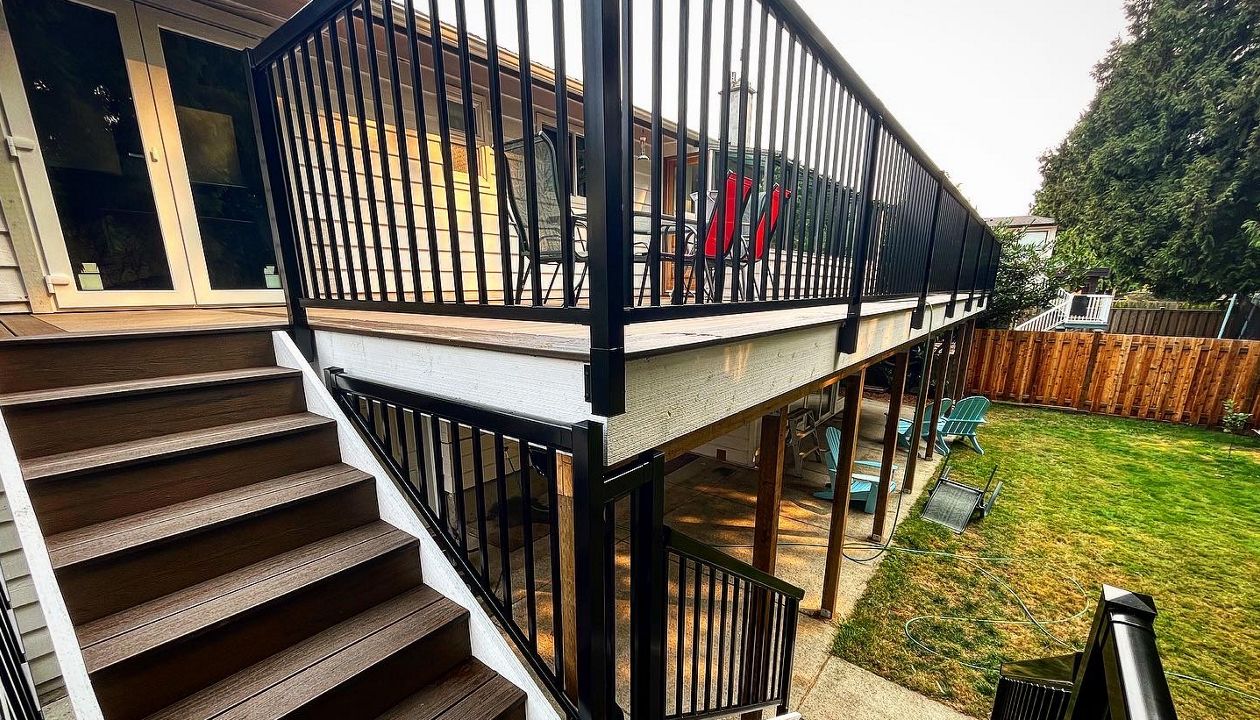 Toasted Sand field, and risers, Spiced Rum bordering. This deck is 100% waterproof via Trex Rainescapes and provides a significant amount of dry usable space beneath.