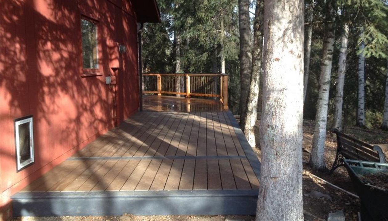 This Beauty is Trex select Saddle with a Winchester Grey boarder and skirt