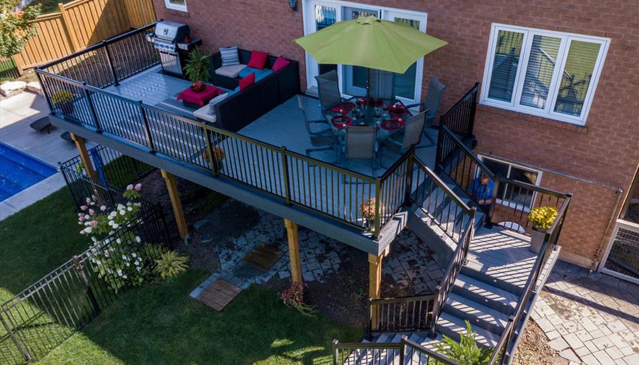 Grey Composite Decking using Select Pebble Grey with Winchester Grey trim - Orangeville, Caledon, Alliston, Bolton