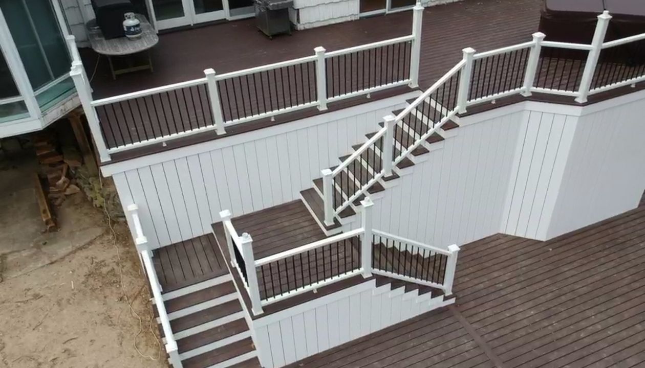 Lava Rock multi-level deck with white PVC skirting
