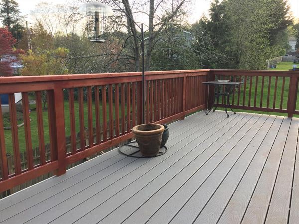 Pebble grey decking with cherrywood stained rails