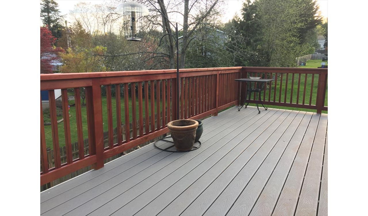 Pebble grey decking with cherrywood stained rails