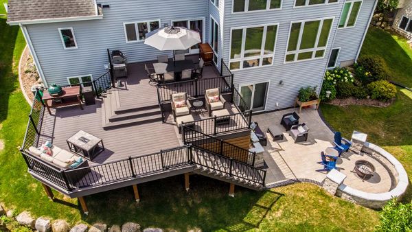 Two levels with 3 separate seating areas, a space for grilling make this deck a true outdoor living space.