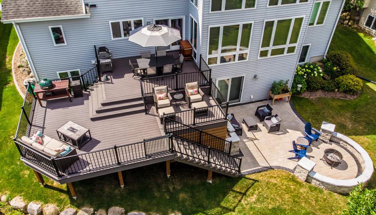 Two levels with 3 separate seating areas, a space for grilling make this deck a true outdoor living space.