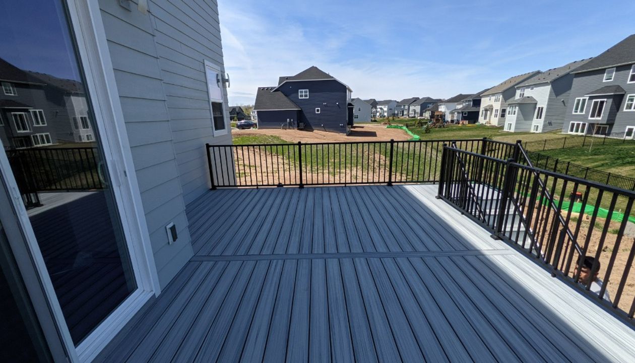 Trex Foggy Wharf Color with black aluminum railings!