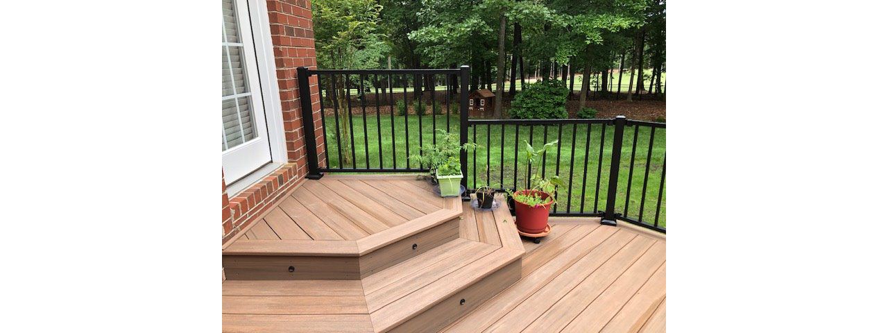 Trex Signature Black railing & lighting makes this project pop