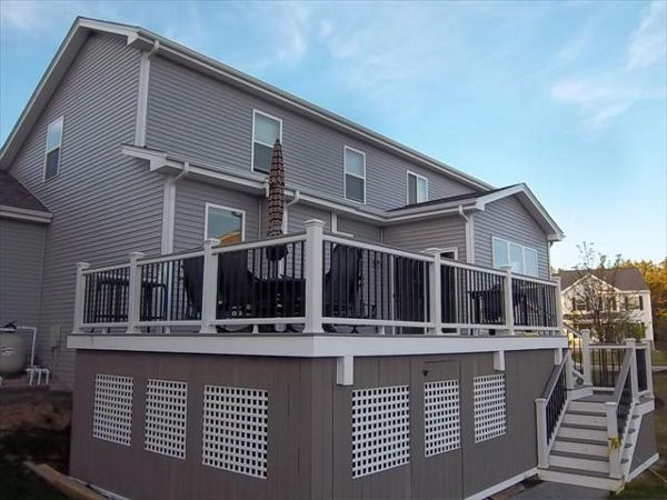 Classic white railing with aluminum balusters. A cool way to vent a storage area underneath