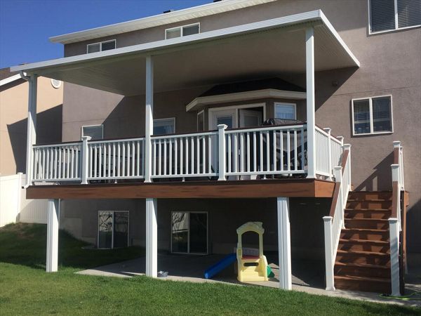 Elveations Steel Framing with Tiki Torch Decking, White Transcend Rail with Fire Pit Cocktail Rail