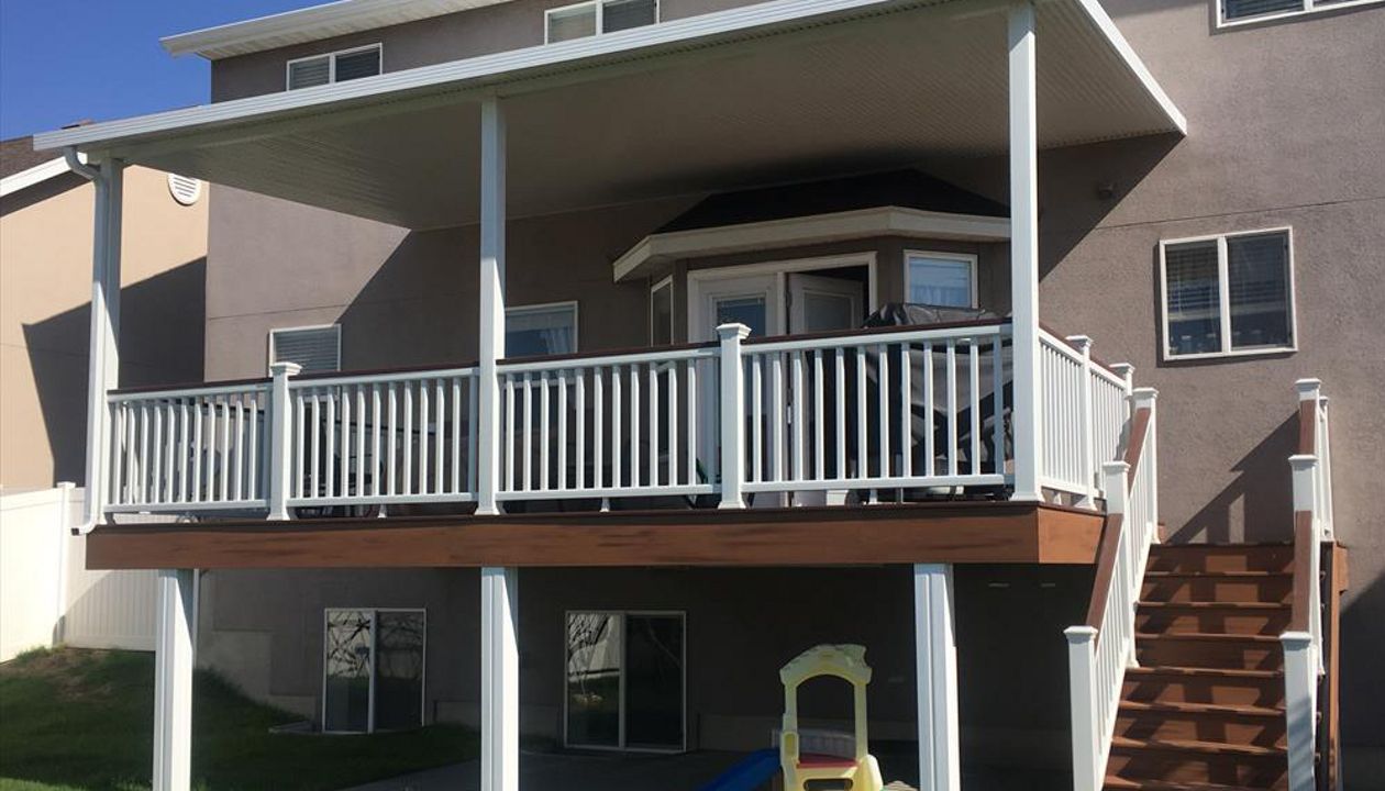 Elveations Steel Framing with Tiki Torch Decking, White Transcend Rail with Fire Pit Cocktail Rail