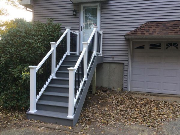 select pebble grey decking risers and fascia, vinyl rails with black metal balusters