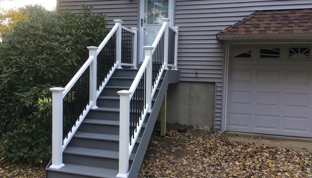 select pebble grey decking risers and fascia, vinyl rails with black metal balusters