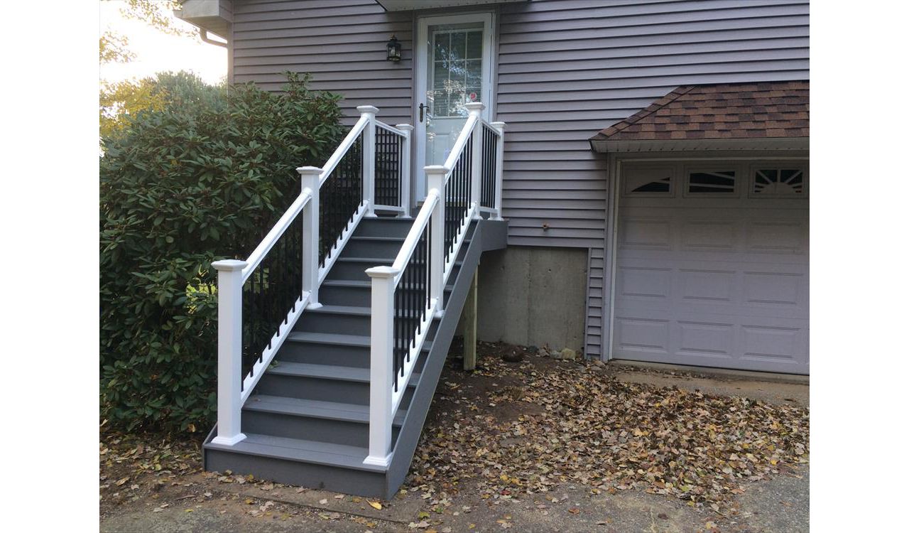 select pebble grey decking risers and fascia, vinyl rails with black metal balusters
