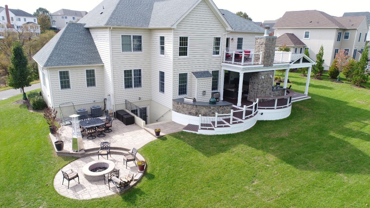 Trex Curved Deck with Open Porch, Fireplace, Outdoor Kitchen, & Paver Patio