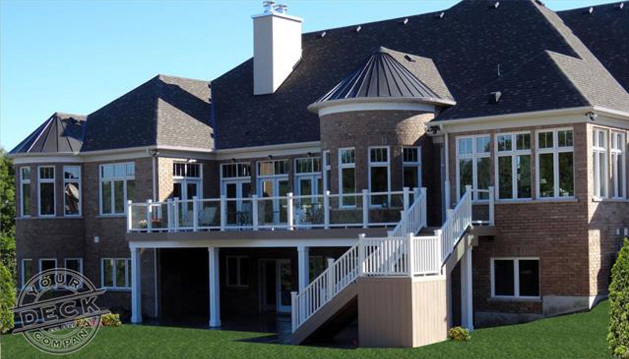 Estate home curved Trex deck by Your Deck Co. in Caledon