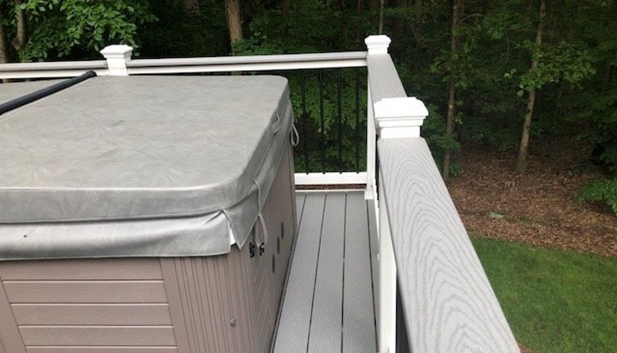Trex Select Pebble Grey deck board top rail cap looks great and can hold your beverage if your relaxing in the hot tub or checking out your great view