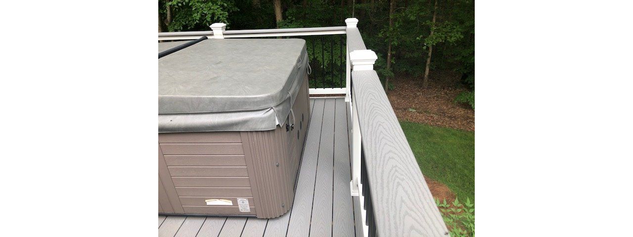 Trex Select Pebble Grey deck board top rail cap looks great and can hold your beverage if your relaxing in the hot tub or checking out your great view