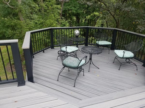 A second look at this deck project features a sunken octagon.This black Transcend railing has the black aluminum balusters and a cocktail rail cap in matching Island Mist.